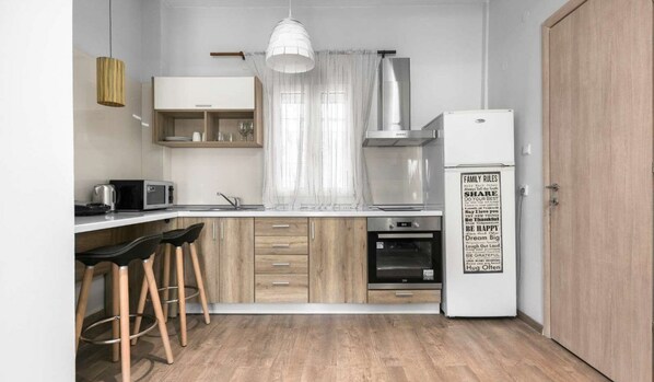City Apartment | Private kitchen | Full-size fridge, oven, coffee/tea maker, cookware/dishes/utensils