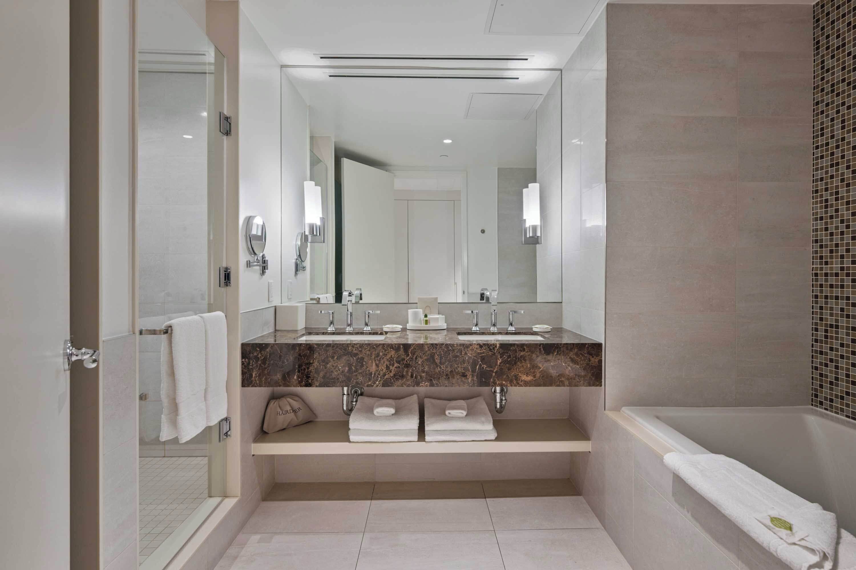 deluxe room, 1 king bed | bathroom | designer toiletries, hair dryer, bathrobes, slippers