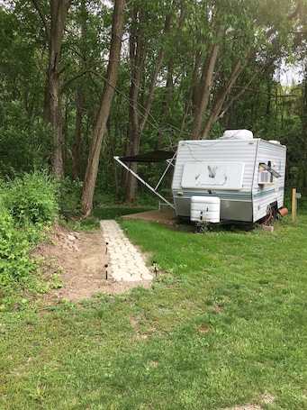 Property grounds. Small camper in the country
