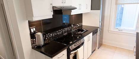 Microwave, dishwasher, coffee/tea maker, cookware/dishes/utensils