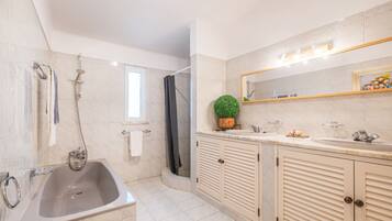 Bathtub, hair dryer, towels