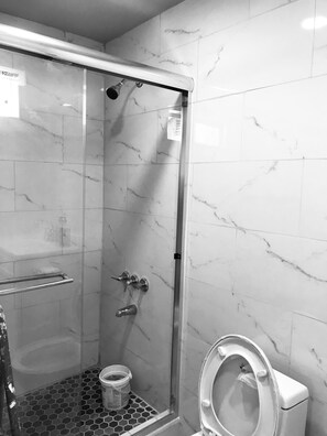 Shower, hair dryer, towels, soap