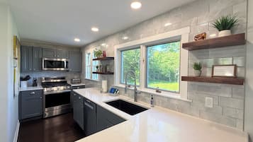 Coffee/tea maker, fridge, microwave, oven