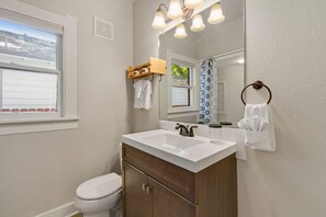 Combined shower/bathtub, hair dryer, towels, soap