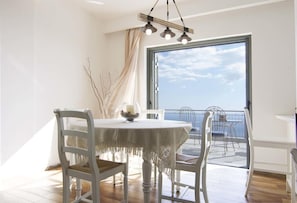 Enjoy a romantic dinner for two at this cozy dining area with a stunning sea view.