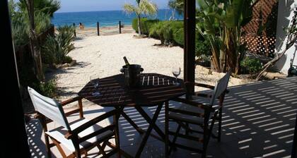 Beach front property, steps away from a beautiful sea