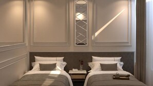 A hotel room with two beds, a nightstand, a decorative wall panel, and a window with a geometric pattern. - City Palace Hotel (Cairo)