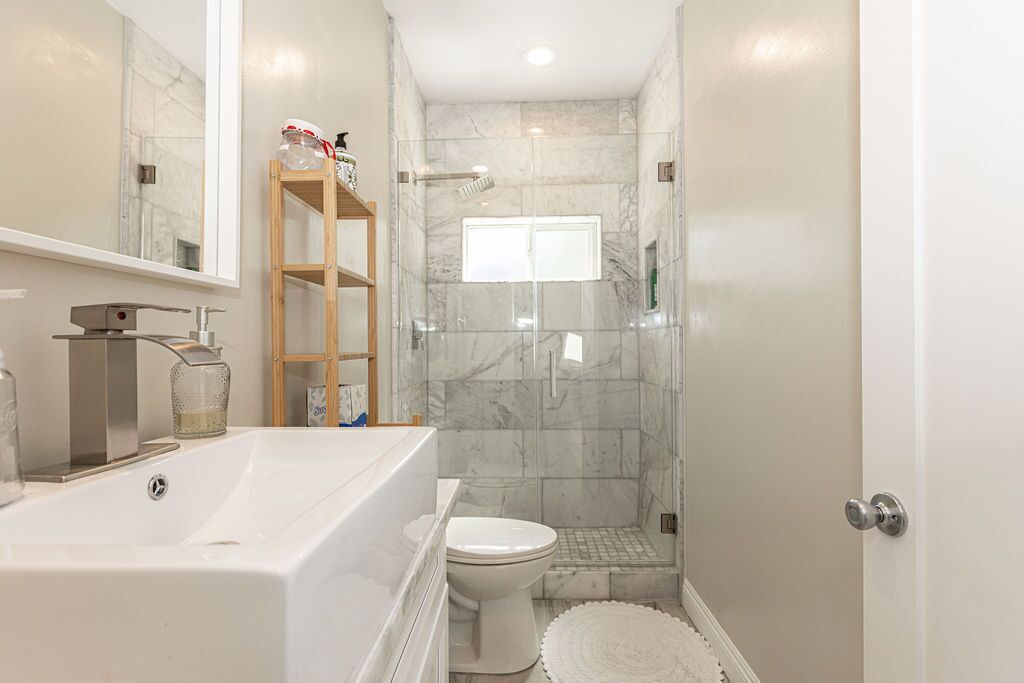 Shower, hair dryer, towels, toilet paper