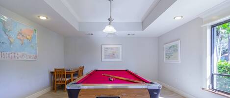 Challenge your mate to a game of billiards located inside the clubhouse