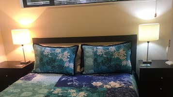 1 bedroom, desk, iron/ironing board, travel crib