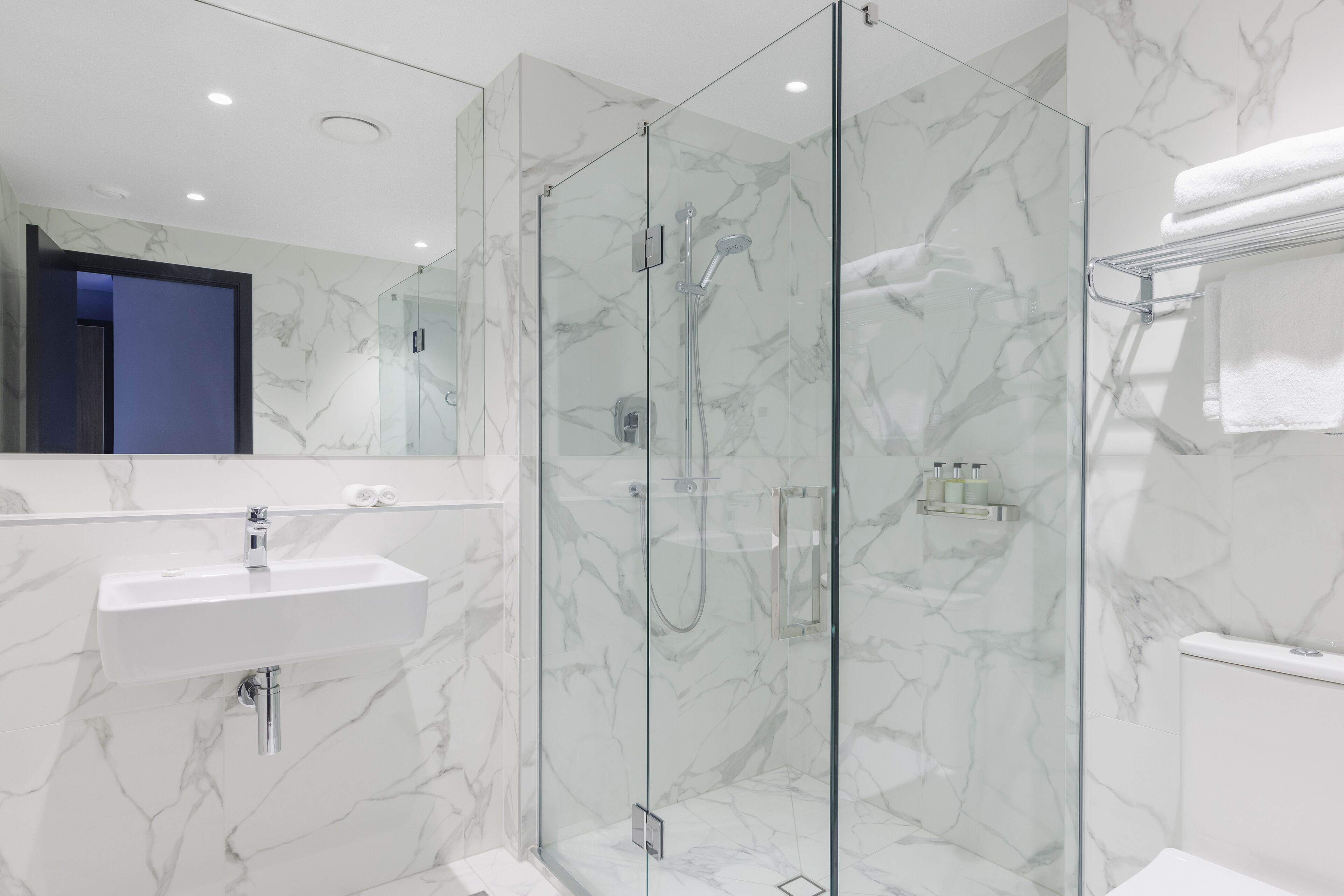 interconnecting studio | bathroom | shower, hair dryer, towels, soap