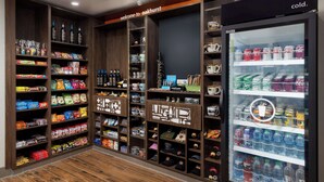 A well-organized retail space with shelves stocked with snacks, beverages, and household items. - Hampton Inn Oakhurst-yosemite, CA (Oakhurst)