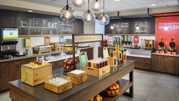 A breakfast buffet area with various food items and a coffee station. - Hampton Inn Oakhurst-yosemite, CA (Oakhurst)