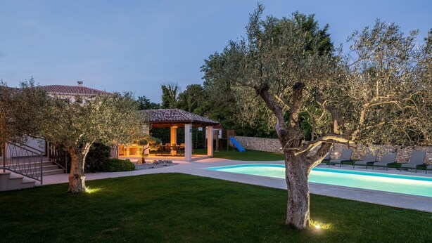 A backyard with a swimming pool, a covered patio, and a slide. - Lovely Villa Gemini with a swimming pool (Visnjan)