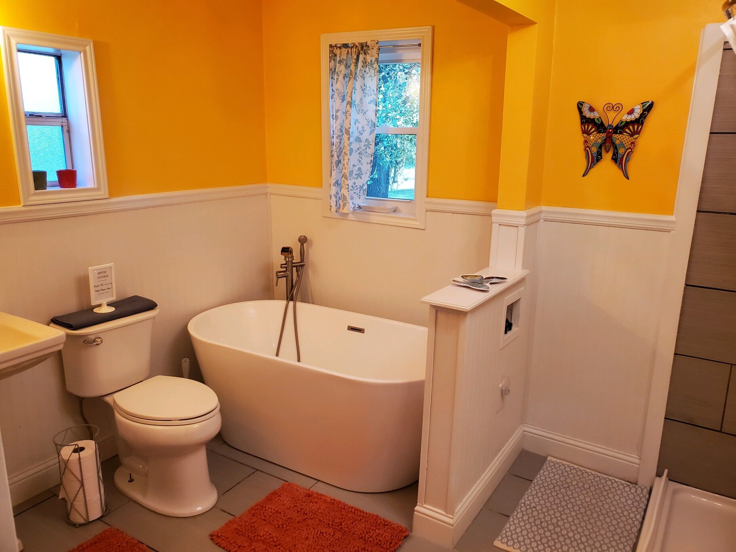 Bathtub, hair dryer, towels, soap