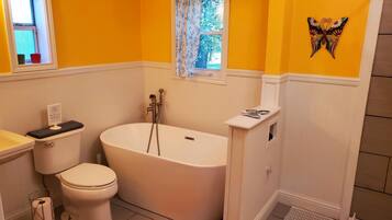 Bathtub, hair dryer, towels, soap