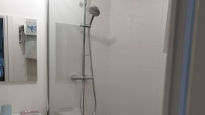 A modern bathroom with a glass shower enclosure, a white sink, and a mirror with a towel rack. - Les Plus Hautes Falaises d' Europe (Criel-sur-Mer)