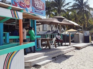 Relax in Salty Crab's beachfront seating area overlooking Junkanoo Beach in Nassau, Bahamas.
