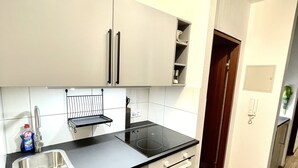 Espresso maker, coffee/tea maker, fridge, oven