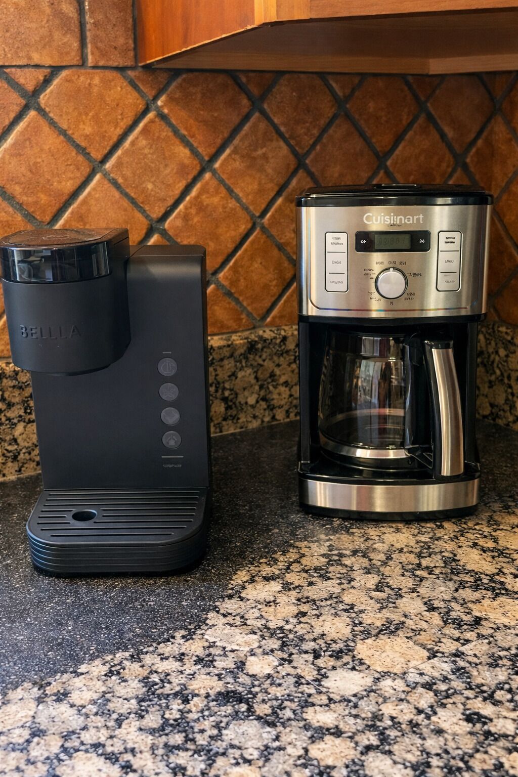 A kitchen with a coffee maker and a water dispenser.