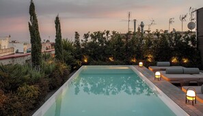 Outdoor pool, open 10:00 AM to 8:00 PM, pool umbrellas, pool loungers
