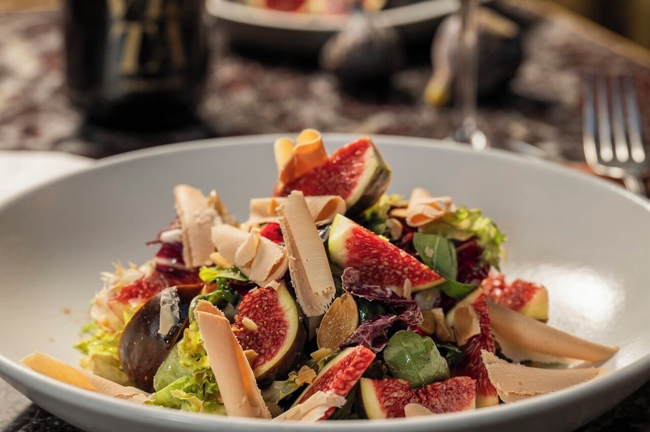 A plate of salad with various ingredients.