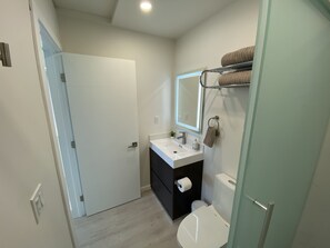 Shower, hair dryer, towels, soap