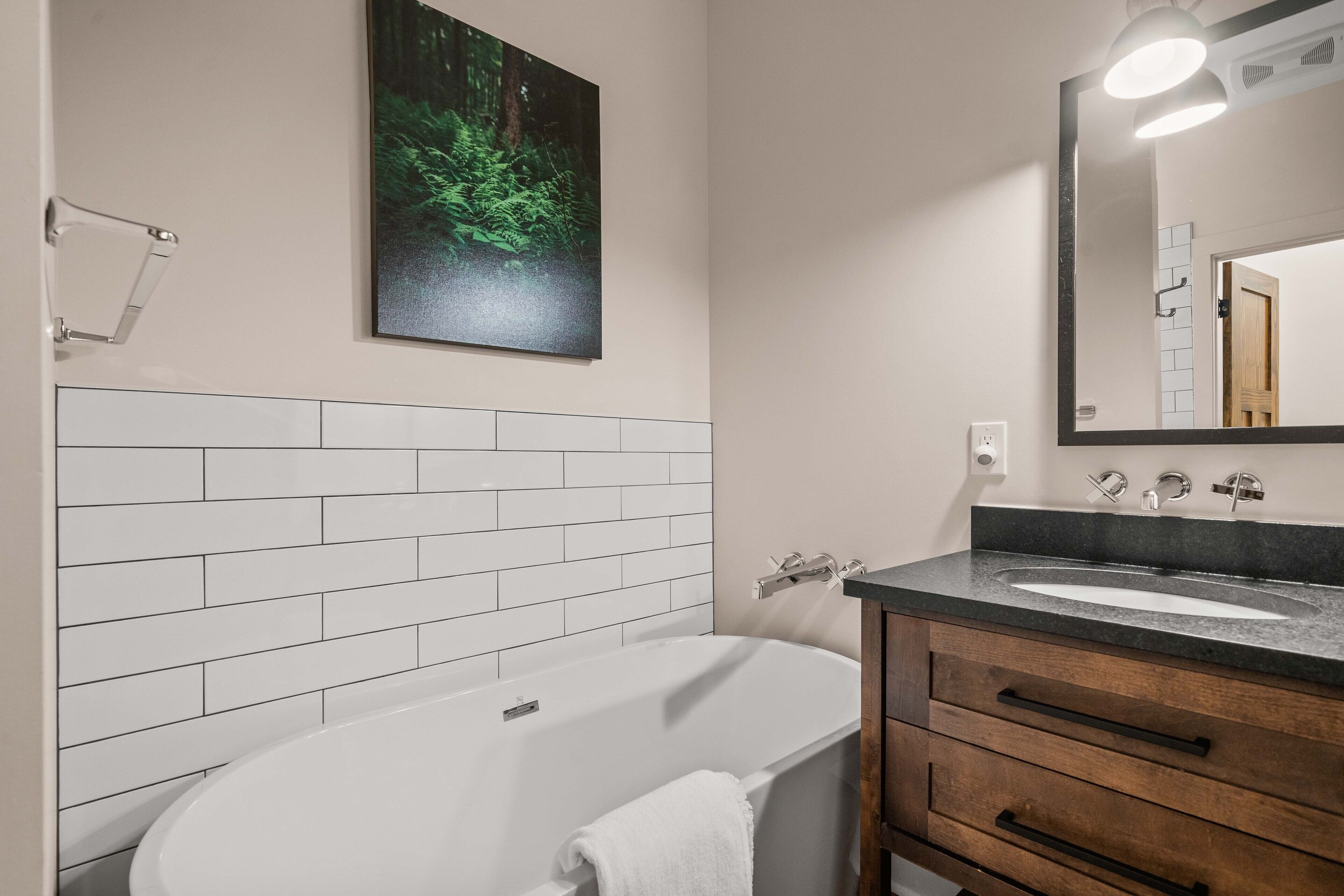 deluxe room | bathroom | separate bathtub and shower, hair dryer, towels