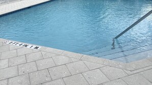 A swimming pool with a depth marker indicating 3 feet 4 inches. - avid hotel Ft Lauderdale Airport – Cruise by IHG (Fort Lauderdale)
