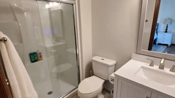 Combined shower/tub, hair dryer, towels, soap