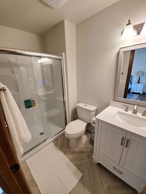 Combined shower/tub, hair dryer, towels, soap