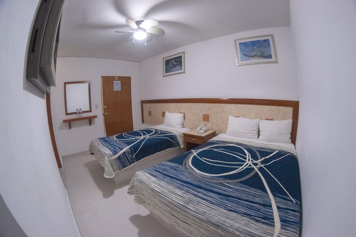 Junior Triple Room | 1 bedroom, iron/ironing board, free WiFi, bed sheets