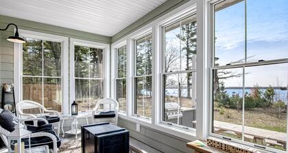 Dog-friendly, lakefront house with beach access, dock, AC, W/D, patio, & firepit