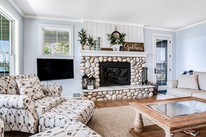 TV, fireplace - Dog-friendly, lakefront house with beach access, dock, AC, W/D, patio, & firepit (St. Germain)