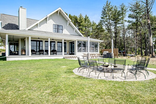 Outdoor dining - Dog-friendly, lakefront house with beach access, dock, AC, W/D, patio, & firepit (St. Germain)
