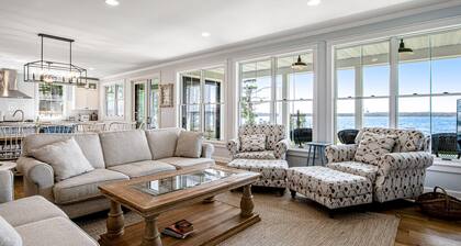 Dog-friendly, lakefront house with beach access, dock, AC, W/D, patio, & firepit