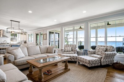 Dog-friendly, lakefront house with beach access, dock, AC, W/D, patio, & firepit