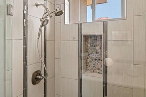 Bathtub, hair dryer, towels, shampoo