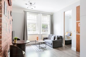 Comfort Apartment | Living area | Flat-screen TV