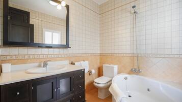 Bathtub, hair dryer, towels