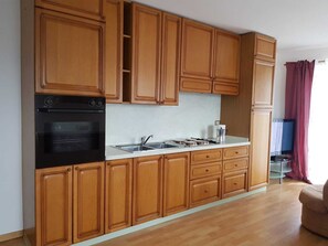 Fridge, stovetop, coffee/tea maker, cookware/dishes/utensils