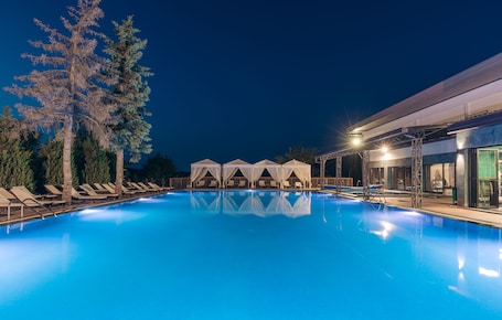 Indoor pool, outdoor pool, pool umbrellas, pool loungers