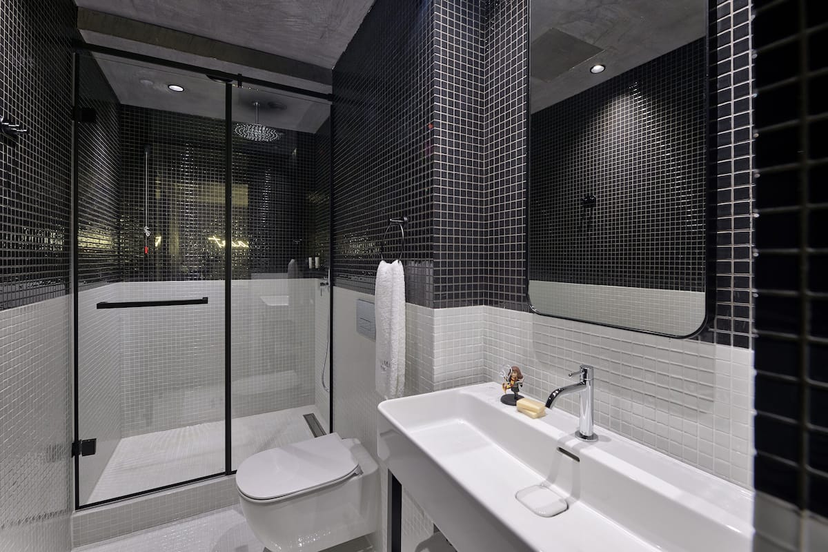 family name | bathroom | eco-friendly toiletries, hair dryer, bathrobes, slippers