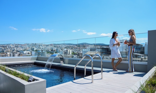 Seasonal outdoor pool, pool umbrellas, sun loungers