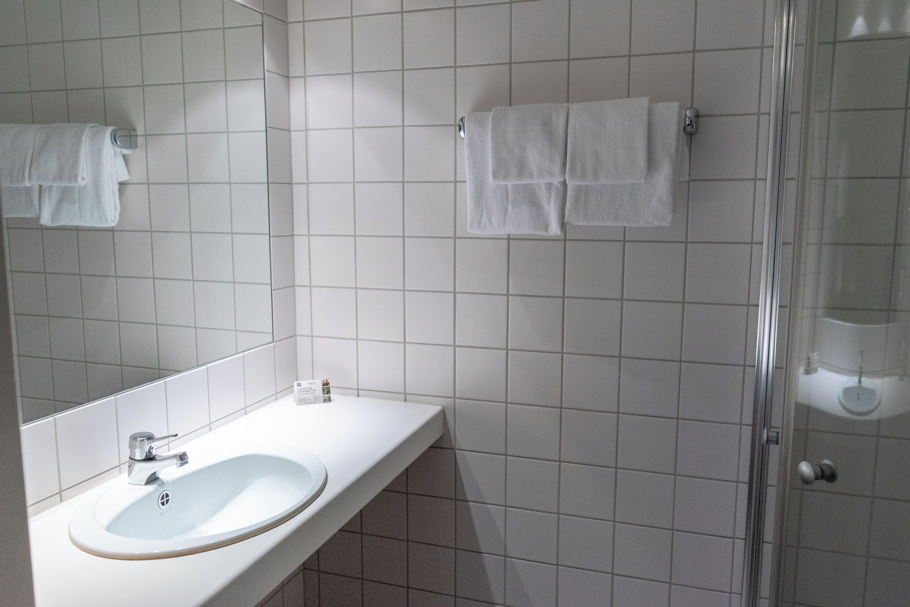 shower, hair dryer, heated floors, towels