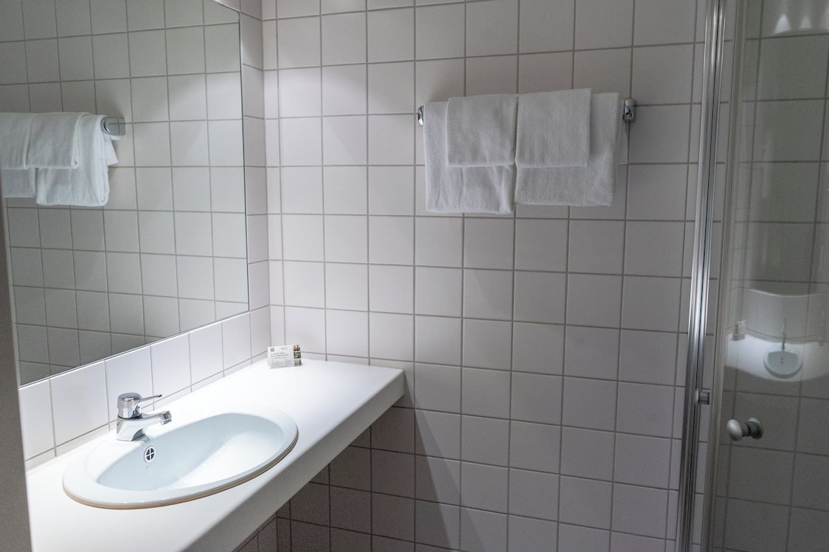 shower, hair dryer, heated floors, towels