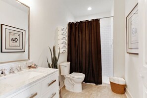 Shower, hair dryer, towels, soap - Refined Historic Renovation (Savannah)