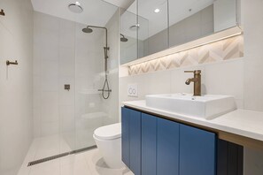 Shower, rainfall showerhead, hair dryer, towels