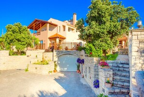 Stunning two-story residence with a spacious balcony and entrance.