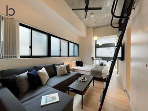 TV, offices - b hotel Neko Yard | Cozy Loft Suite in Center (Naka Ward, Hiroshima)
